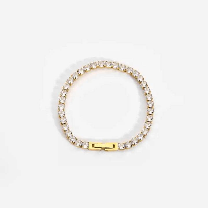 Gold-toned Zircon Bracelet featuring clear crystal stones in a sleek stainless steel design