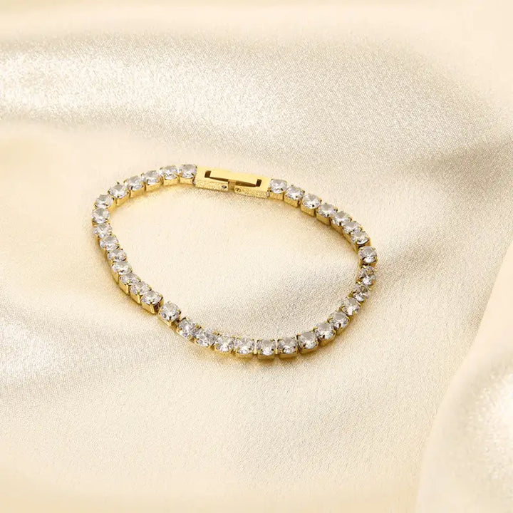 Gold-toned Zircon Bracelet with clear crystal stones in a linear stainless steel setting